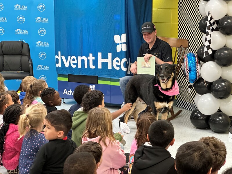 NASCAR Driver Reads to Children and Delivers a "Bookworm" Vending Machine to Volusia Elementary School